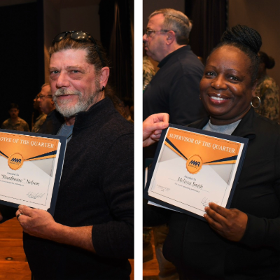 A picture of Myron Nelson and Melissa Smith holding certificates